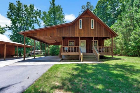 This is Cabin #2 at Fisherman's Landing equipped with your very own vehicle or boat shelter that has lights, electricity, and water hookups. The boat shelter is 16' wide x 36' long.