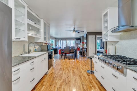 Main level kitchen with dishwasher, oven, stove top, full sized refrigerator.  Fully equipped with pots, pans, dishes, silverware, coffee maker, toaster, blender, mixer, kitchen gadgets, everything you will need.