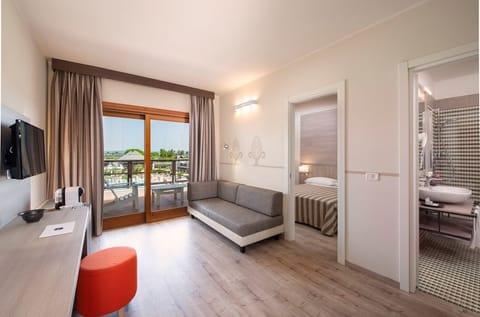 In-room safe, desk, laptop workspace, bed sheets