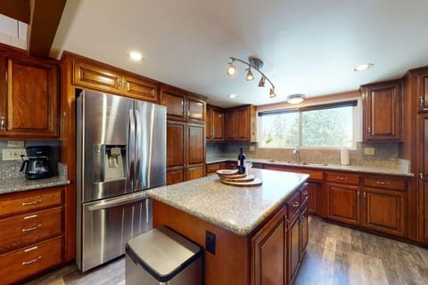 Gourmet kitchen with center island and large fridge for all your goodies