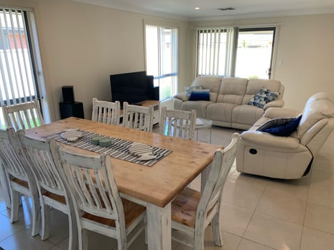 Relax in the living room and relax with family and friends at the kitchen table.