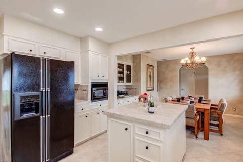 Fully equipped kitchen with electric stovetop and double ovens