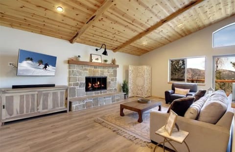 Open living room with great views, vaulted wood ceilings and relaxing decor