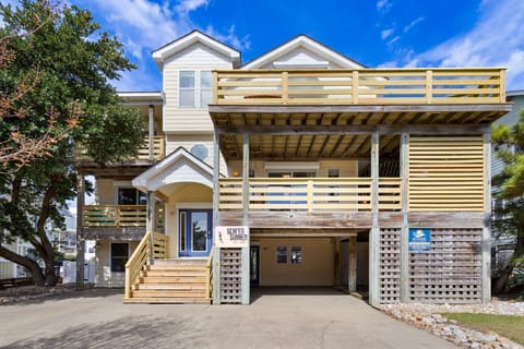 Welcoming coastal cottage with fresh landscaping, new fencing, and plenty of charm in Ocean Sands Section O.