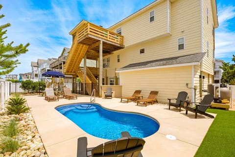 Take a dip in the pool and relax on the sunny lounge chairs.