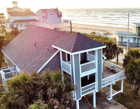 Our home is steps away from the beach with an expansive wraparound deck.