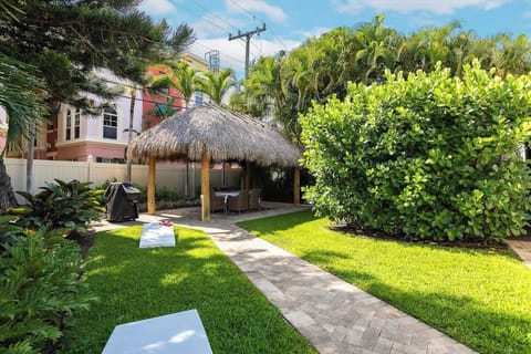 Enjoy the large spacious wonderfully landscaped backyard, with a Tiki Hut (including seating for 6 and a large screen TV), grill and yard games!