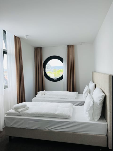 Premium bedding, down comforters, in-room safe, desk