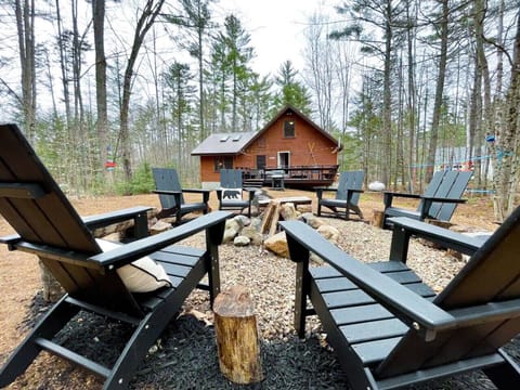 Embrace the warmth of our outdoor space with a cozy backyard firepit