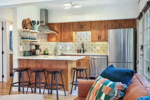 Full kitchen with seating for four.