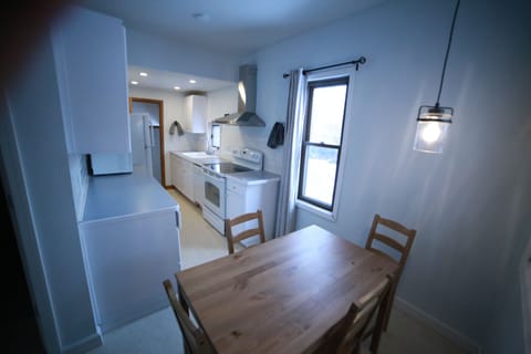 Farmhouse kitchen with eat in table for 4.