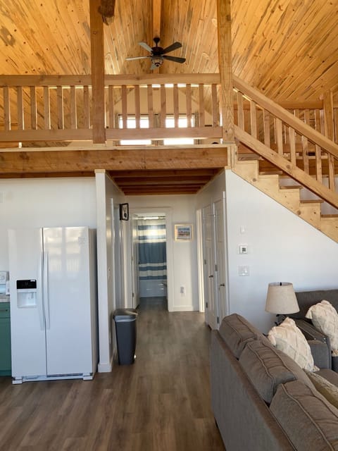 View of the hallway and loft coming in the front door
