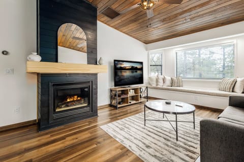 Living room with fireplace & smart TV