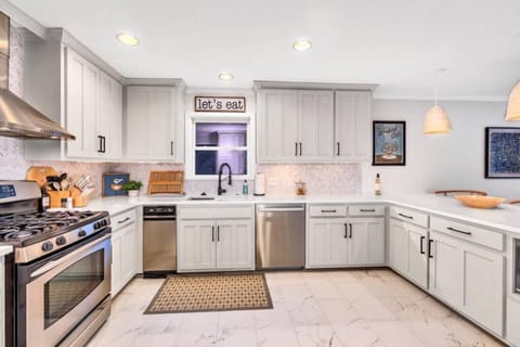 Kitchen fully stocked with all cooking essentials, oven, trash compactor, dishwasher, microwave, stove and drop coffee maker