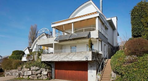 Free standing house with 2-3 parking spots in front of house.