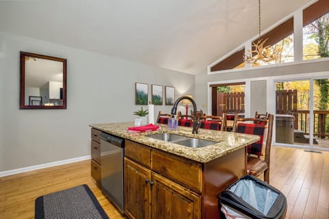 Kitchen with bar top seating.