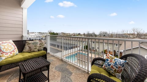 Sunny balcony retreat with comfortable seating and scenic views