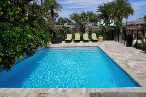 Relaxing poolside with the ocean just steps away — best of both worlds.