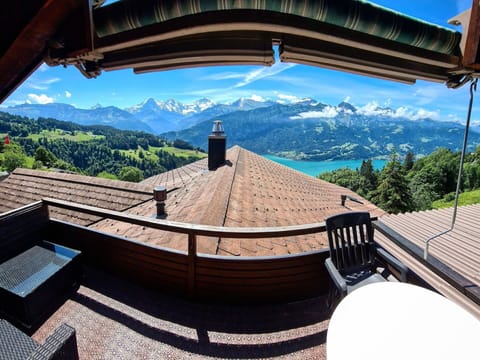Sky, Property, Window, Building, Mountain, World, Cloud, Plant, Slope, House