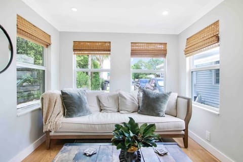 Relax on this comfy couch in the sunroom.