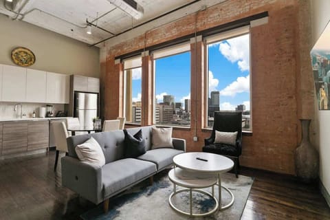 Unwind with stunning city views and modern decor in this bright urban retreat!