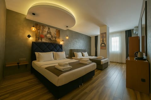 Standard Triple Room | Premium bedding, minibar, in-room safe, individually decorated