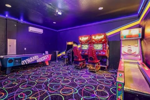 Experience endless fun in this vibrant game room with arcade classics, air hockey, and skee-ball, perfect for all ages.