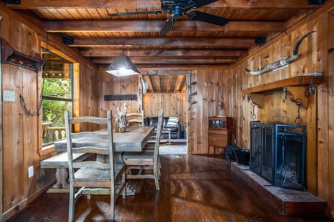 The sturdy wooden dining table features traditional as well as bench seating.