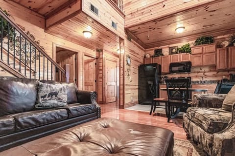 From the comfort of the living space, you can see straight on back to the kitchen and entryway, easy flowin’ Southern charm.