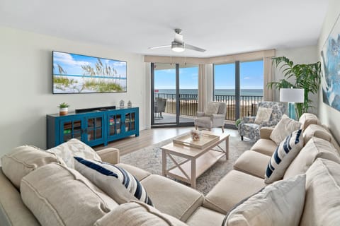 Enjoy your morning coffee with a breathtaking ocean view from the comfort of this living room, featuring a sleeper sofa for extra guests.
