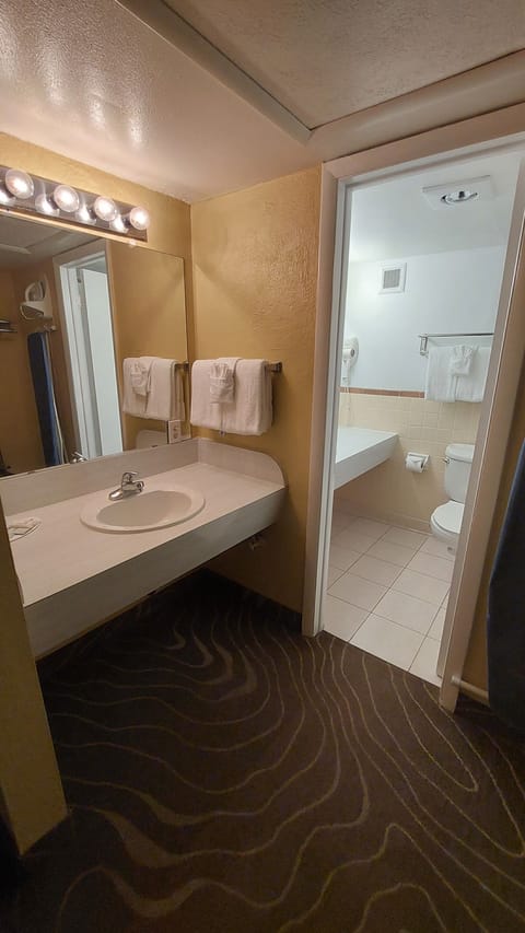 Economy Double Room | Bathroom | Combined shower/tub, hair dryer, towels, soap