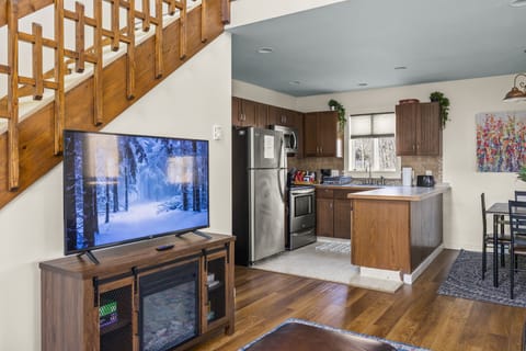 Enjoy the view of kitchen activities while hanging out on the couch.