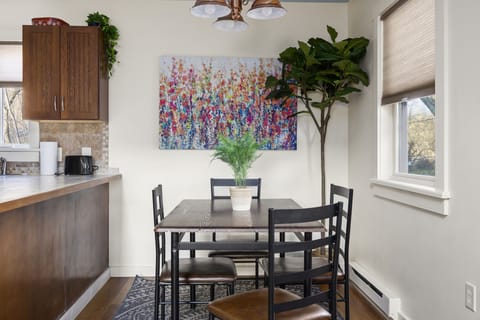The dining room is next to the kitchen, ready home cooked meals.