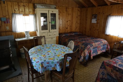 Cabin 6 features two full size beds and a twin cot. (1)