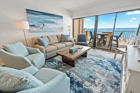Welcome to the heart of comfort and style! The main living room invites you to unwind and socialize, seamlessly connected to a cozy seating area. Step outside to the balcony for a breath of fresh air and a captivating view.