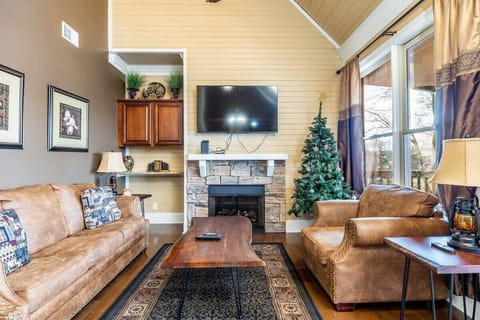Bright and airy retreat with a rustic touch, featuring a warm fireplace and cheerful decor!