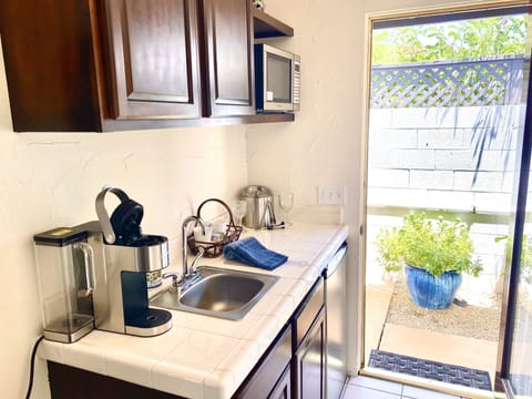Suite, 1 King Bed, Pool View | Private kitchenette | Fridge, microwave, coffee/tea maker, toaster