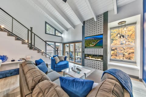Cozy up with loved ones and watch a movie on this living room's 55" Smart TV.