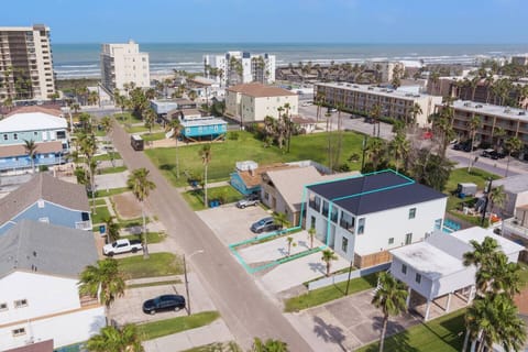 Coastal retreat steps from beach with stunning aerial views