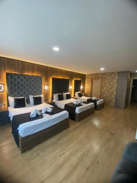 Premium bedding, desk, laptop workspace, soundproofing