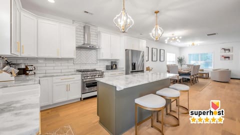 Bright and fully equipped kitchen featuring modern appliances, spacious countertops, and all the essentials you need to prepare delicious meals. Perfect for cooking, dining, and creating memorable moments with family and friends.