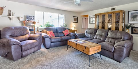 Huge living room with plush couches and recliner. Queen sofa bed. 