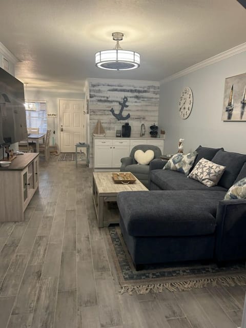 Spacious, living room with large flat screen tv