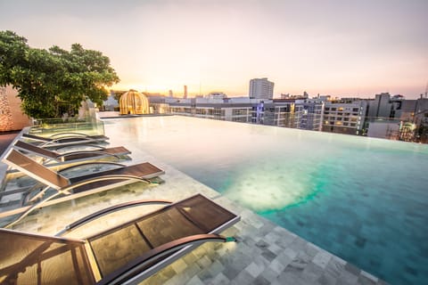 Outdoor pool, open 7:00 AM to 8:00 PM, pool umbrellas, sun loungers