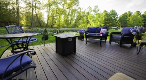 Large outside sitting area with fire table.