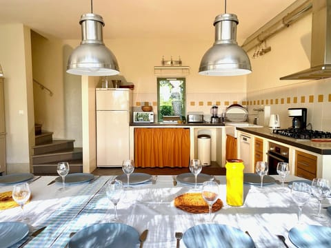 Large fridge, 5 gas cooking stove. One of the 2 staircases. 