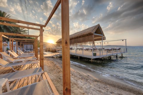 Private beach, free beach shuttle, free beach cabanas, sun loungers