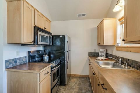 Cook up a delicious meal in this cute kitchen.