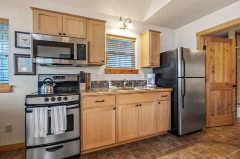 Delightfully detailed kitchen with the basic cooking equipment and utensils.