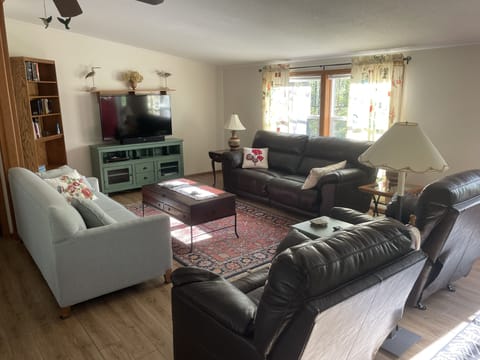 Cozy living room with 55” Smart TV, cable, DVD and blu ray player